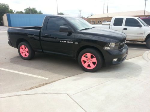 2012 black ram 1500 in like new condition w/ pink rims and pink interior accents
