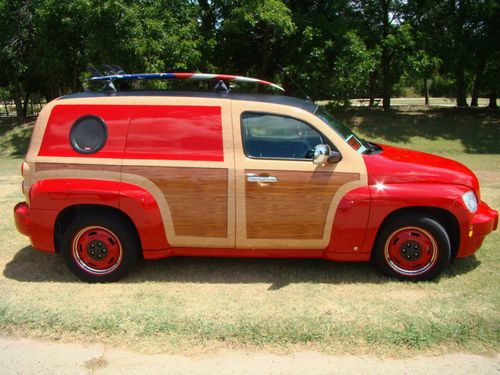 Custom woody tribute with surf board, custom leater interior, wood grain dash