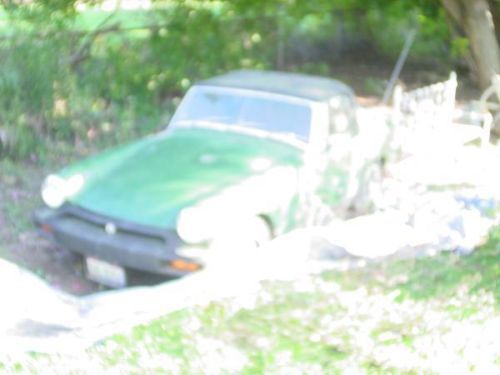 1976 mg midget sports car ran when last parked 3 years ago presently under tarp