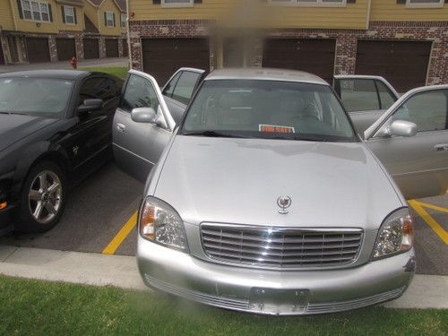 2002 silver cadillac deville 64k miles. drives excellent and fully loaded interi