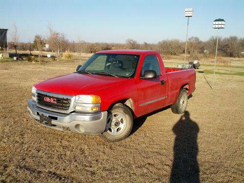 Red 2004 gmc sierra 1500 single cab in good condition.