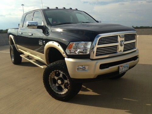 Mega cab, 4 - door, 6-inch lift, 33 inch tires, train horn, h&amp;s tuner, leather