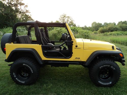 2203 jeep wrangler x custom lift lifted with 35 inch tires solar yellow