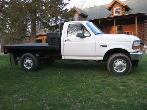 Good running good looking f250 flatbed 4x4 5.8 v8 low miles 82k boss plow ready