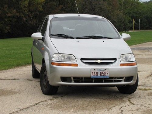 2004 chevrolet aveo sedan 4-door 1.6l auto 77,950 miles silver w gray interior