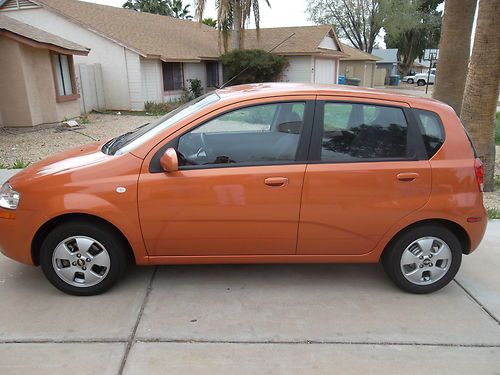 2006 chevy aveo ls auto alloy wheels rare sunset orange color only 25000 miles