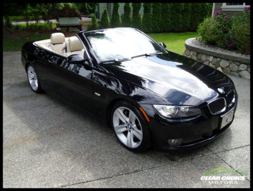 2008 bmw 335i hard top convertible. black with tan leather. fully loaded!