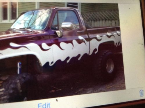1974 chevy pickup red and white 36 inch mud tires with lift