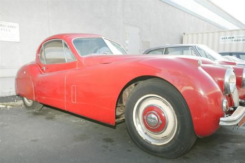 1952 red jag, in good condition, all original, garaged its whole life