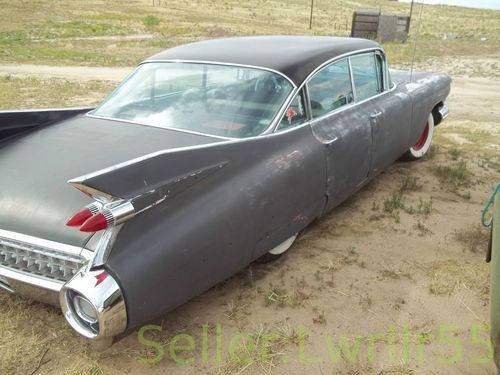 1959 cadillac 4 door with 3 1/2 in wide whites and air bag rear suspension.