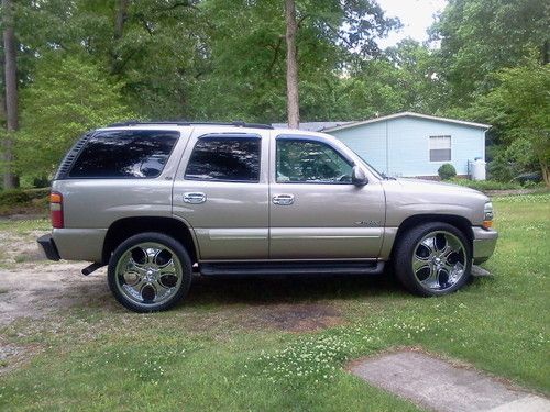 Tan suv on 24 inch tires and rims