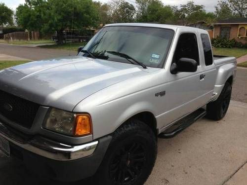 Selling silver 2001 ford ranger xlt 4x4 new rims and tires and sound system
