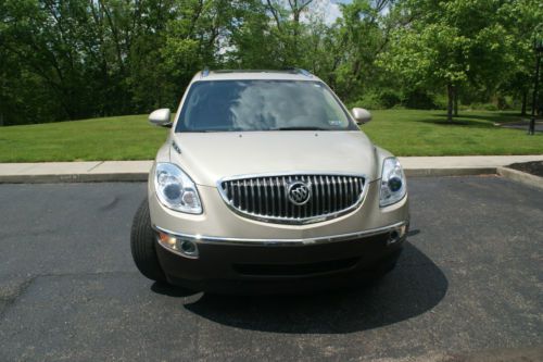 Awd 26,900 miles with 3 yr warranty. gold w/ beige interior. drives &amp; looks new!