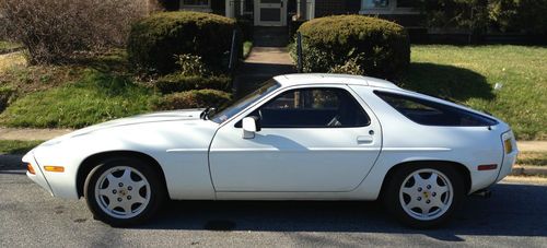 White w/blue leather excellent condition, stock 5 speed 105,000 mi. no winters!!