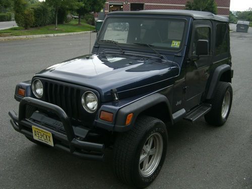 1997 jeep wrangler tj 4 cylinder automatic rare, no dents, new soft top. mustsee