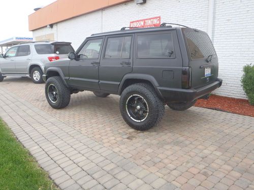 1997 jeep cheerokee 4 inch lift a/c flat black full cage 4x4 nitro tires perfect