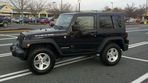 2008 black jeep wrangler rubicon - includes both hard and soft tops