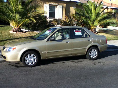 2001 mazda protege lx, excellent cond, low miles 59,988 over 35 mpg, 4 cylinder