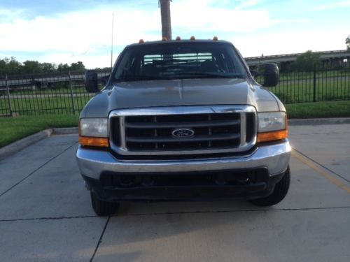 2001 f350 7.3l diesel dually flatbed crewcab 4x4, needs some work. mech special!