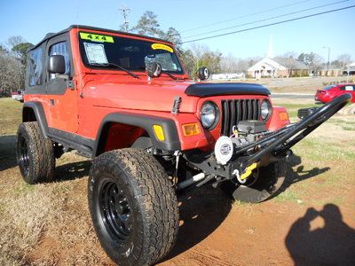 4.0l i-6 cyl orange paint lifted, off road tires and wheels, winch, x package
