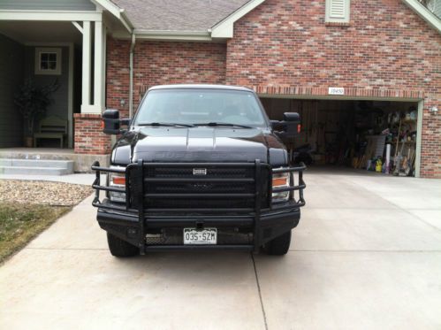 F350  fx4 spercab (4door) long bed with step feature in tailgate black on black