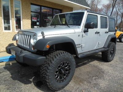 Unlimited jk 4 door lifted 4 inch lift 35 tires 7 k miles 1 owner clean carfax
