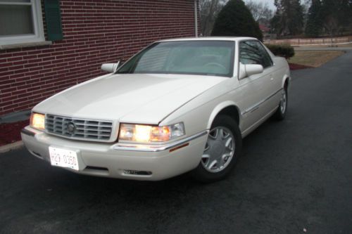 Pearl white, loaded, very low miles 51k great con.no rust