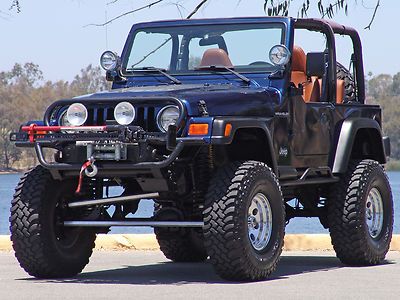 2002 jeep wrangler 4x4 lifted on 33's built to climb must see!!!