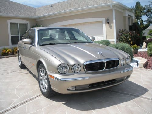 2004 jaguar xj8 w/ extended wty color tan w/ivory leather interior 25000 miles