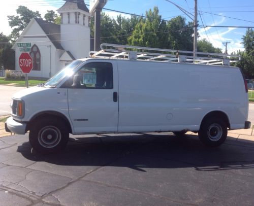 White chevy 3500 express cargo work van with 131,286 miles in good condition.