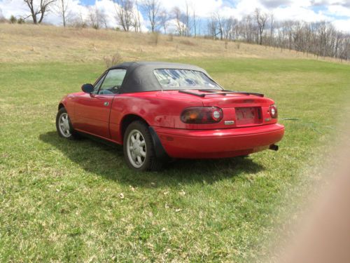 Unmodified miata, second owner, 5-speed, cruise, air, power windows, hard top