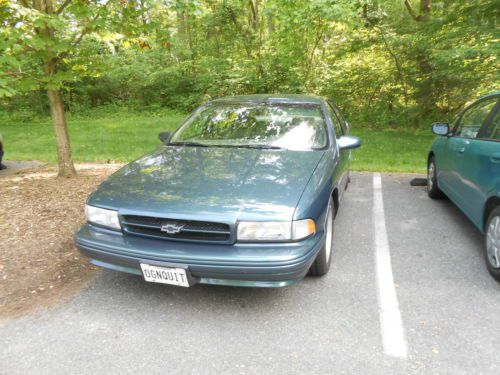1996 impala ss excellent condition dark green 30450 miles spectackular 2 issues