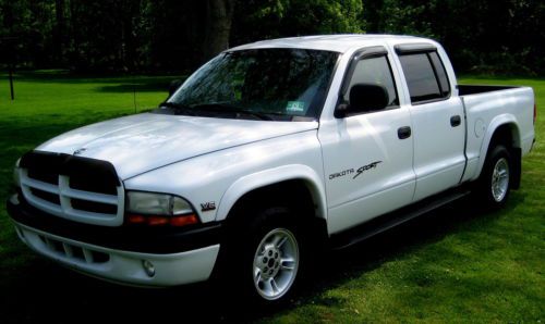 2000sport pkg. quad cab,3.9l v-6,ps, pdb, automatic,ac,new bed liner,cruise,exc.