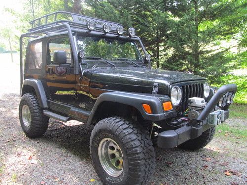 Black 2001 4x4 jeep wrangler 4 inch lift, only 76,902 miles a real head turner!!